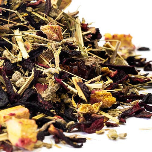 Assorted dried herbs and flowers on a white background