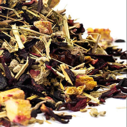 Assorted dried herbs and flowers on a white background