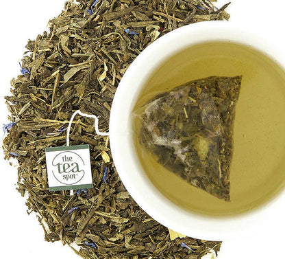 Tea leaves and a cup of tea with 'The Tea Spot' branding.
