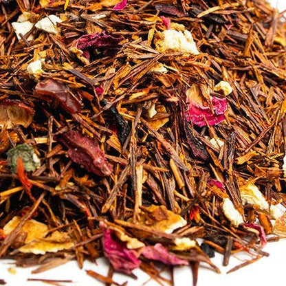 Heap of mixed dried herbs and flowers on a white background